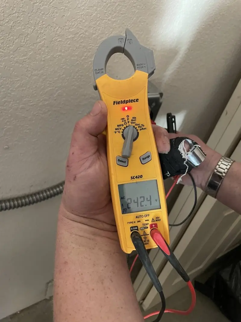 Voltage testing with clamp meter during Generator Installation in Mequon